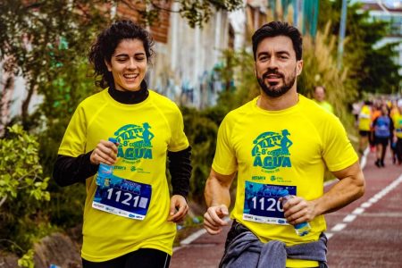 Two athletes participating in a marathon, showing determination and joy.